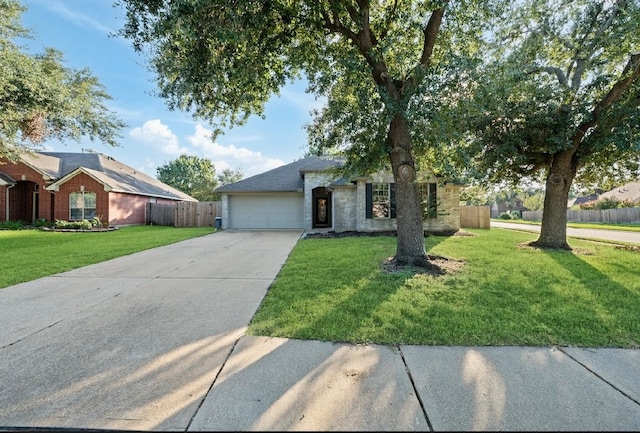 view of front of home featuring a garage and a front lawn