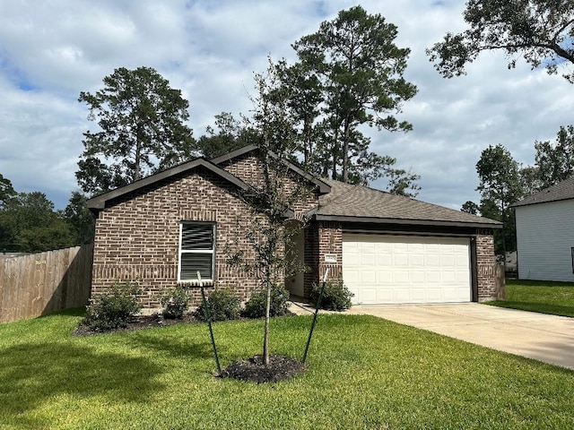 view of front of house featuring a garage and a front yard