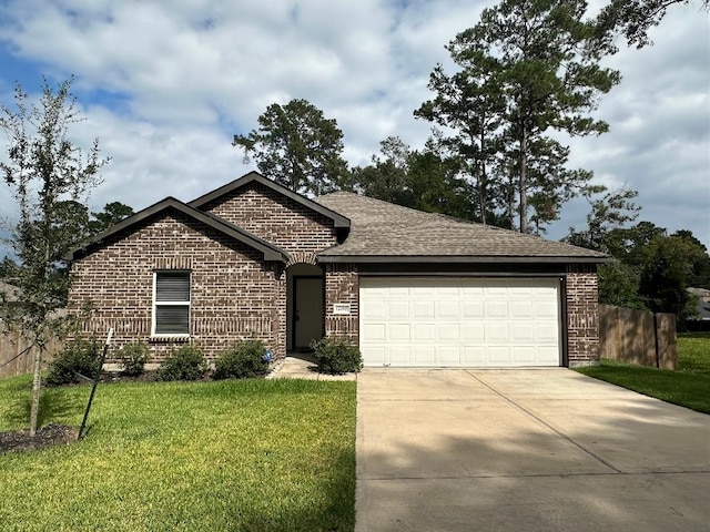 single story home featuring a front lawn and a garage