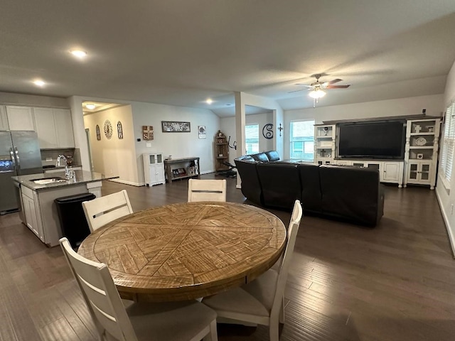 dining area with sink, ceiling fan, and dark hardwood / wood-style floors