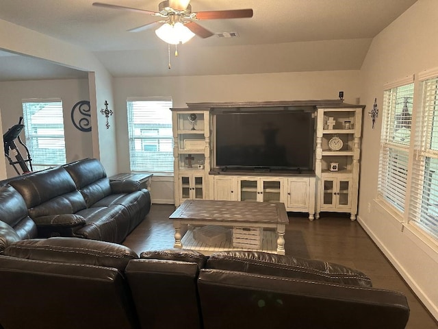 living room with lofted ceiling, ceiling fan, plenty of natural light, and dark hardwood / wood-style floors