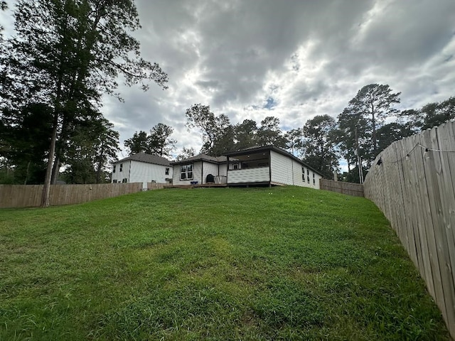 view of yard featuring a wooden deck