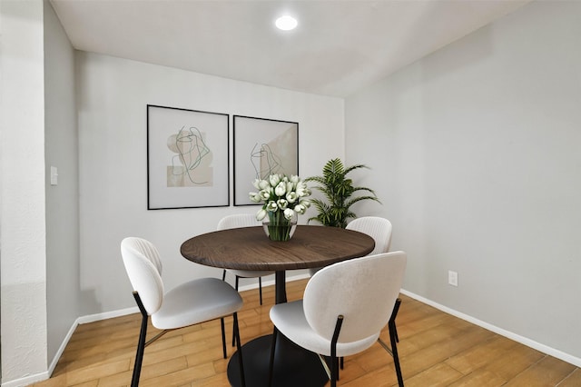 dining area with light hardwood / wood-style floors