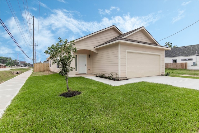 single story home featuring a garage and a front yard