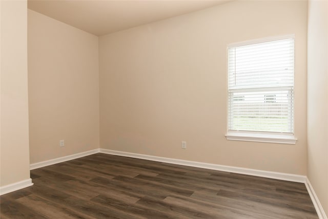 unfurnished room featuring dark hardwood / wood-style floors