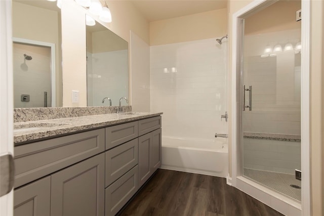 bathroom featuring vanity, independent shower and bath, and hardwood / wood-style flooring