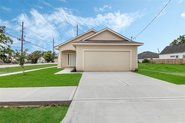 view of front of house featuring a front lawn and a garage