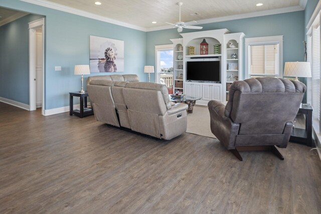 living room with ornamental molding, ceiling fan, plenty of natural light, and dark hardwood / wood-style flooring