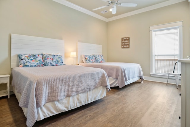 bedroom featuring ornamental molding, ceiling fan, and hardwood / wood-style floors