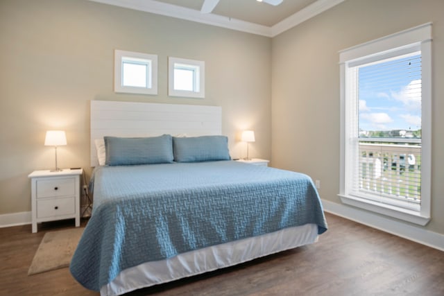 bedroom featuring multiple windows, crown molding, dark hardwood / wood-style floors, and ceiling fan