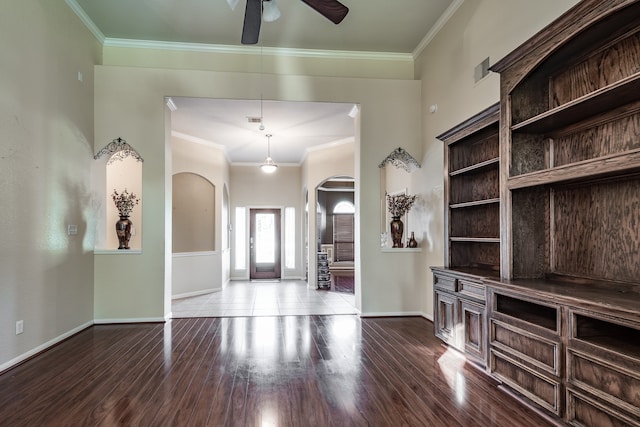 interior space featuring crown molding, hardwood / wood-style floors, and ceiling fan