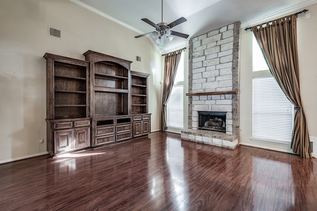 unfurnished living room with high vaulted ceiling, crown molding, ceiling fan, a fireplace, and wood-type flooring