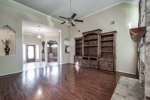 unfurnished living room featuring high vaulted ceiling, a brick fireplace, ceiling fan, ornamental molding, and dark hardwood / wood-style flooring