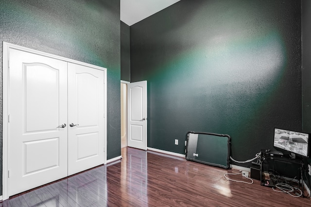 interior space featuring hardwood / wood-style floors and a closet