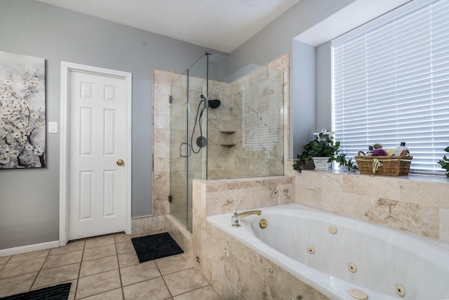 bathroom featuring tile patterned flooring and separate shower and tub