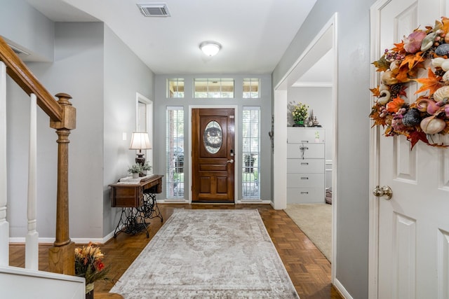 entrance foyer with dark parquet floors