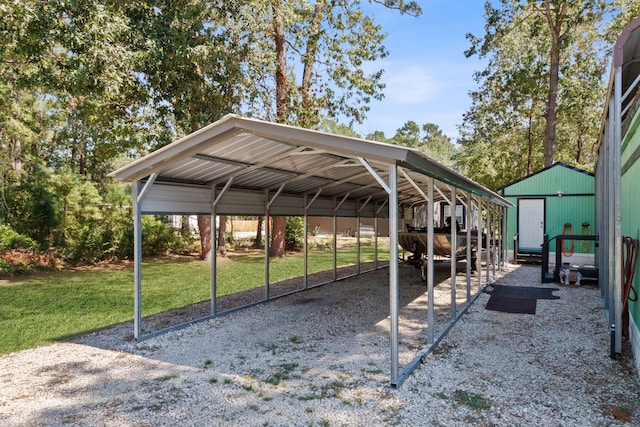 view of vehicle parking with a yard and a carport