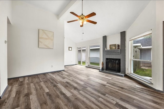 unfurnished living room with a brick fireplace, high vaulted ceiling, wood-type flooring, and ceiling fan