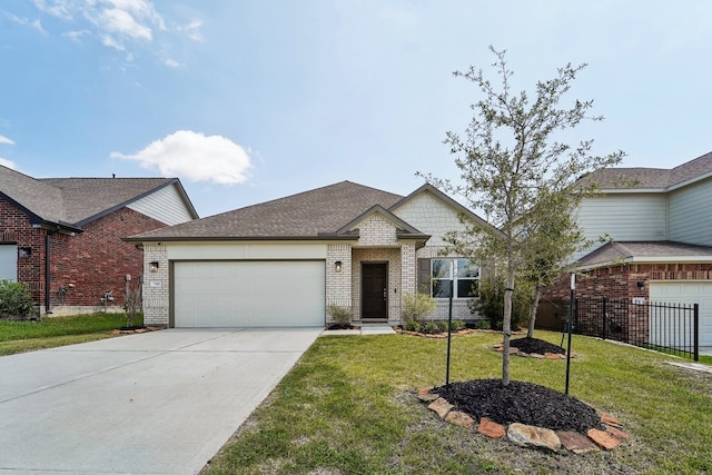 view of front of property featuring a garage and a front lawn