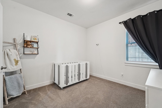 carpeted bedroom with radiator and a crib