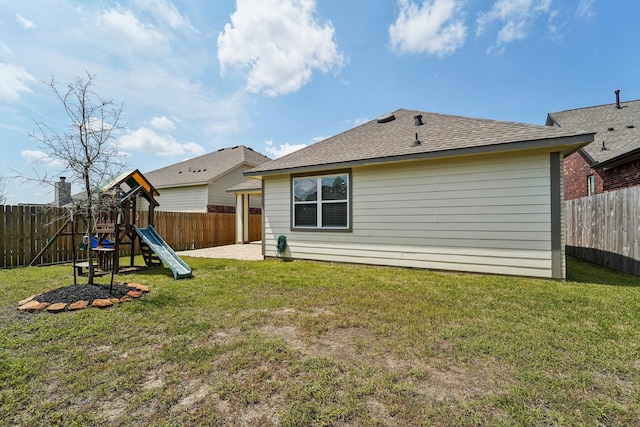 rear view of house with a patio area, a playground, and a yard