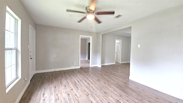 spare room featuring ceiling fan and light hardwood / wood-style flooring