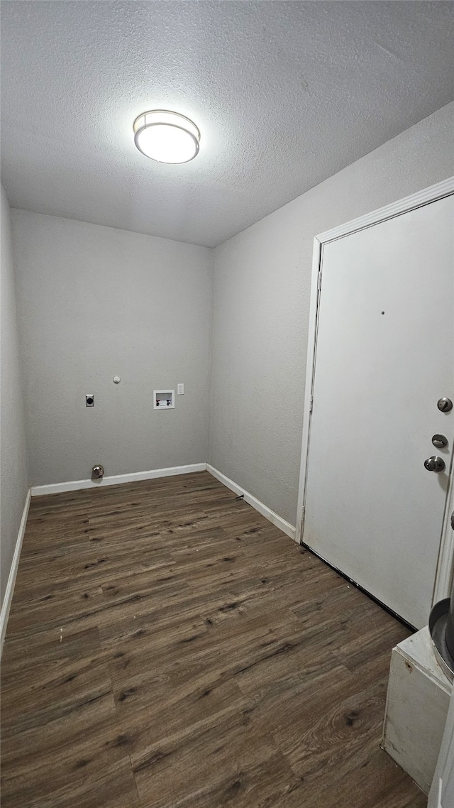 washroom featuring dark hardwood / wood-style floors and a textured ceiling