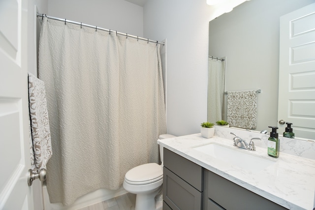 full bathroom with vanity, toilet, and shower / bath combo with shower curtain