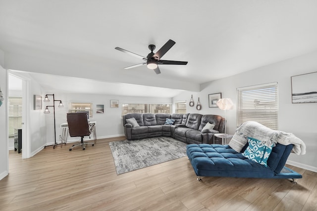 living room with a healthy amount of sunlight, ceiling fan, and light hardwood / wood-style floors