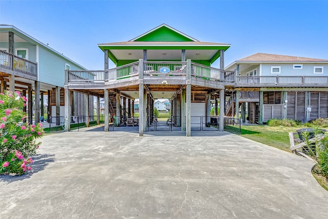 exterior space with a carport and a porch