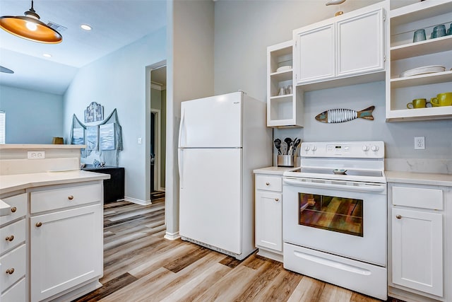 kitchen featuring decorative light fixtures, white appliances, light hardwood / wood-style floors, lofted ceiling, and white cabinets