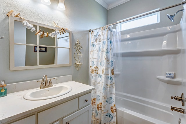 bathroom with crown molding, vanity, and shower / bathtub combination with curtain