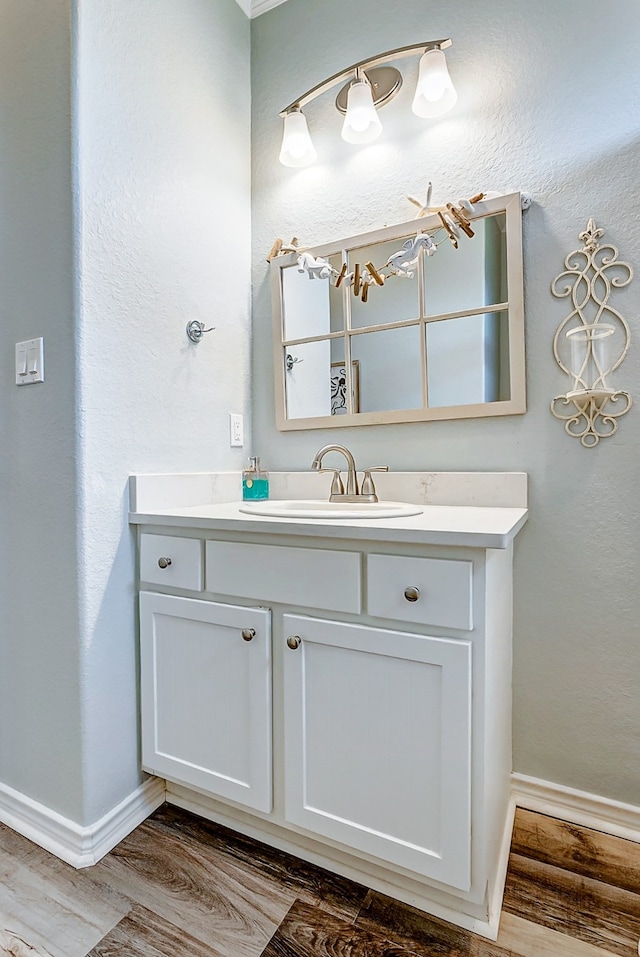 bathroom with wood-type flooring and vanity