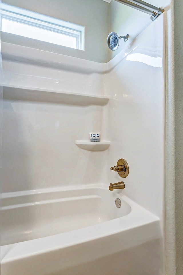 bathroom with shower / tub combination