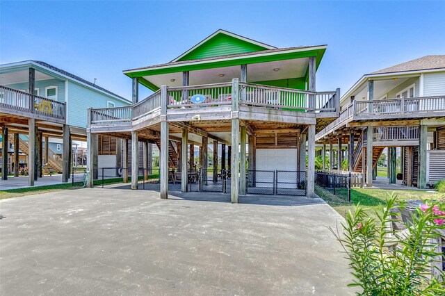 view of front of house featuring a porch and a carport