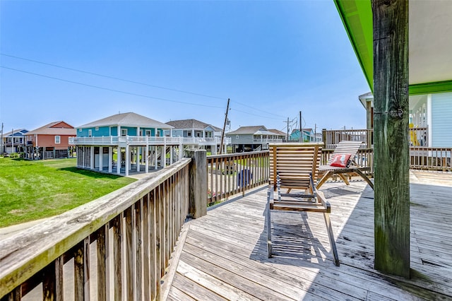 wooden deck with a lawn