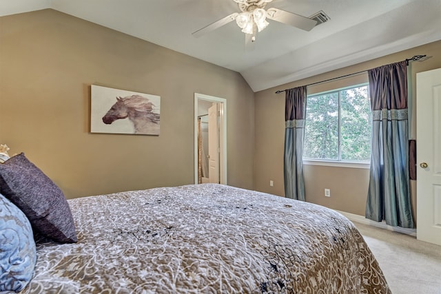 bedroom with light carpet, a ceiling fan, visible vents, vaulted ceiling, and baseboards