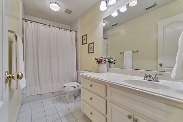 bathroom featuring toilet, vanity, tile patterned flooring, and visible vents