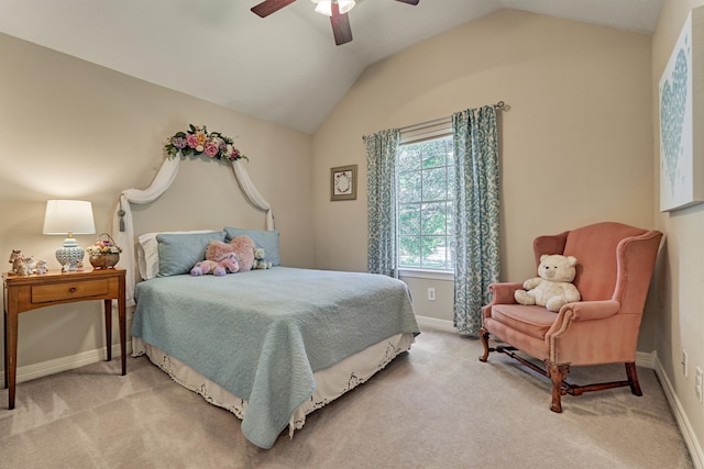 bedroom featuring light carpet, vaulted ceiling, and baseboards