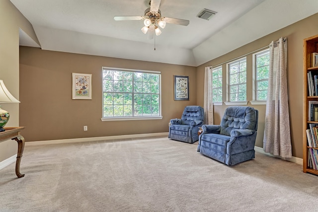 living area featuring light carpet, visible vents, and baseboards