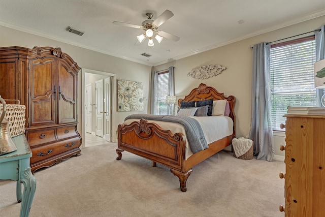 bedroom featuring light colored carpet, visible vents, crown molding, and multiple windows