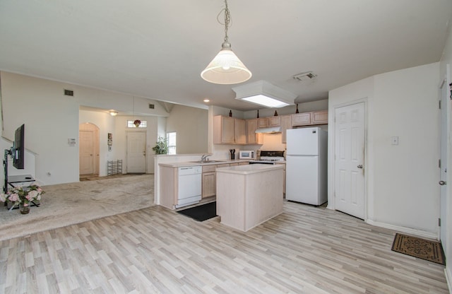 kitchen with light wood-type flooring, white appliances, sink, and light brown cabinets