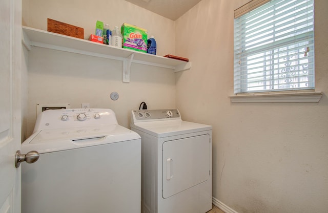 clothes washing area featuring washing machine and clothes dryer