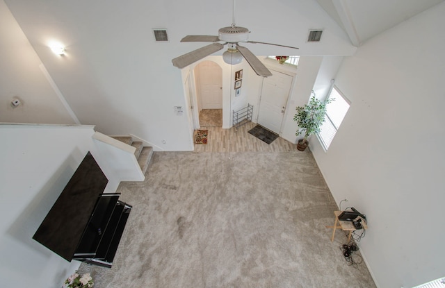 interior space featuring high vaulted ceiling and ceiling fan