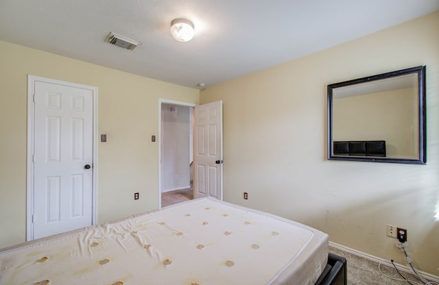 bedroom with light colored carpet