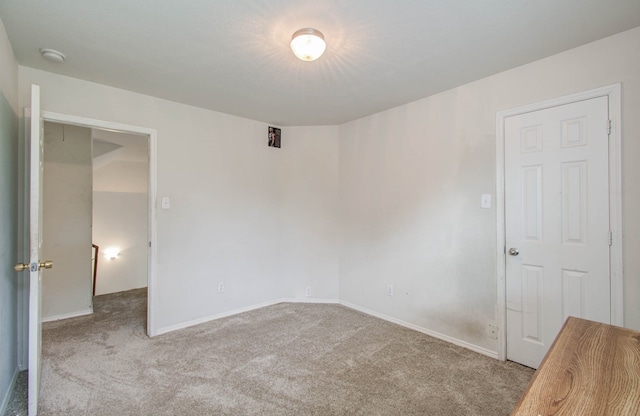 unfurnished bedroom featuring light colored carpet