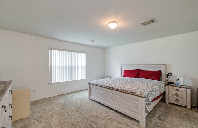 bedroom with light carpet