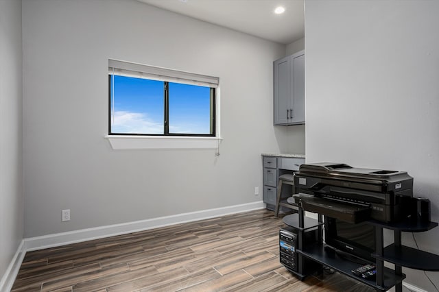 home office with hardwood / wood-style flooring