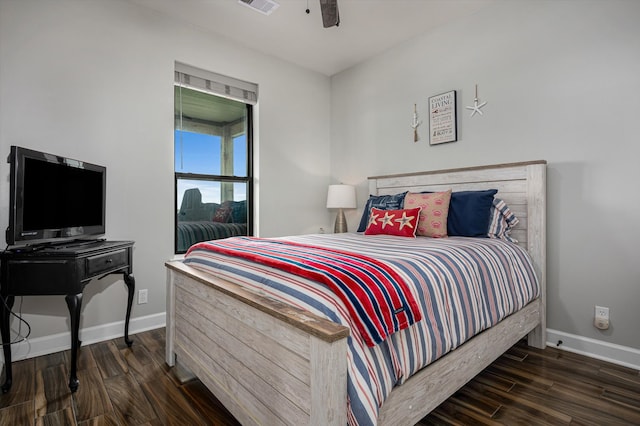 bedroom with ceiling fan and dark hardwood / wood-style flooring