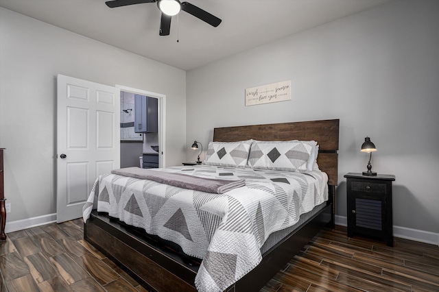 bedroom with ceiling fan, connected bathroom, and dark hardwood / wood-style floors